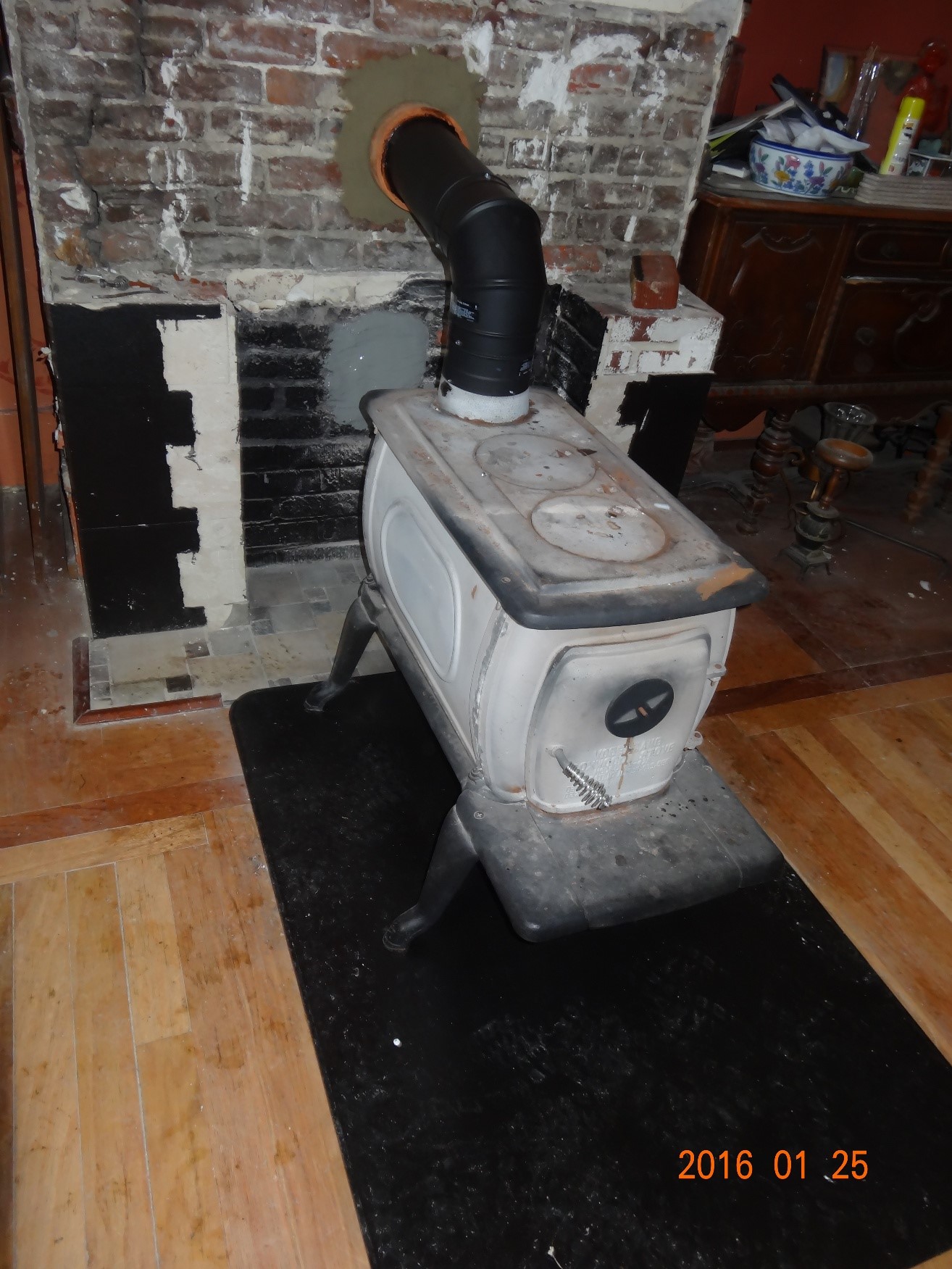 Free standing wood stove fixed